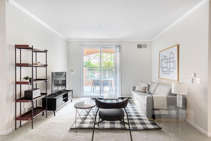 Elegantly designed living room with modern furnishings in an apartment at Villa Del Sol in Sunnyvale, San Francisco Bay Area