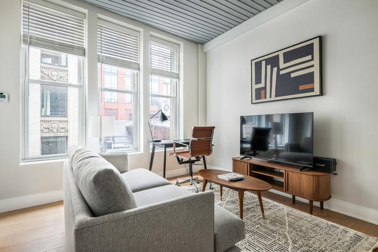 Elegantly designed living room with modern furnishings in an apartment at 44 Bromfield in Boston, Boston Elegantly designed living room with modern furnishings in an apartment at 44 Bromfield in Boston, Boston