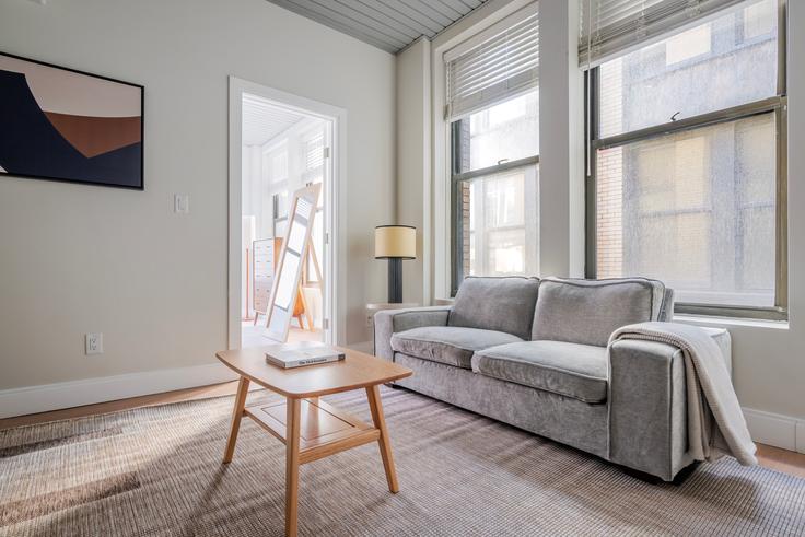 Elegantly designed living room with modern furnishings in an apartment at 44 Bromfield in Boston, Boston Elegantly designed living room with modern furnishings in an apartment at 44 Bromfield in Boston, Boston