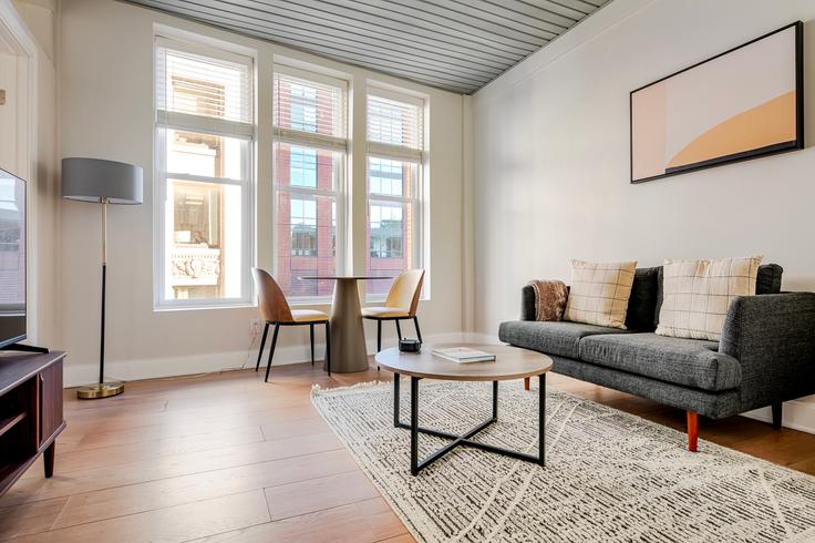 Elegantly designed living room with modern furnishings in an apartment at 44 Bromfield in Boston, Boston Elegantly designed living room with modern furnishings in an apartment at 44 Bromfield in Boston, Boston