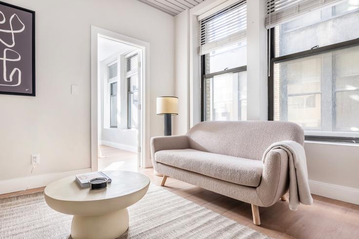 Elegantly designed living room with modern furnishings in an apartment at 44 Bromfield in Boston, Boston Elegantly designed living room with modern furnishings in an apartment at 44 Bromfield in Boston, Boston