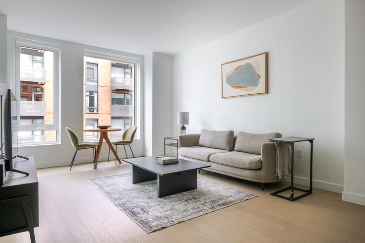 Boston BostonのThe Harrisのアパートメントにある、モダンな家具を備えたエレガントなデザインのリビングルーム