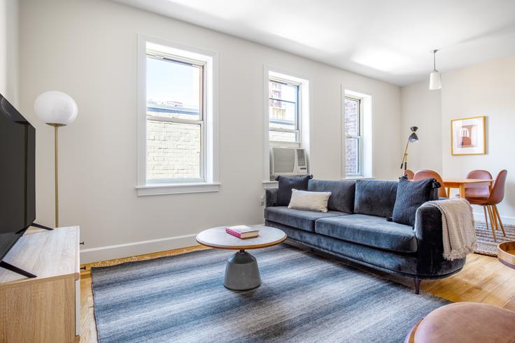 Elegantly designed living room with modern furnishings in an apartment at The Manhattan in Upper East Side, New York