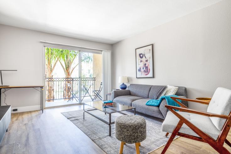 Elegantly designed living room with modern furnishings in an apartment at The Plaza at Sherman Oaks in Los Angeles, Los Angeles