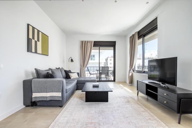 Elegantly designed living room with modern furnishings in an apartment at Savva Lazaridi I in Glyfada, Athens