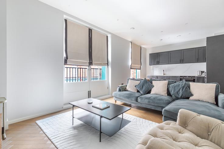 Salle de séjour élégante avec mobilier moderne dans un appartement à 25 Toynbee Street, London, E1 7NE à London Borough of Tower Hamlets, London Salle de séjour élégante avec mobilier moderne dans un appartement à 25 Toynbee Street, London, E1 7NE à London Borough of Tower Hamlets, London