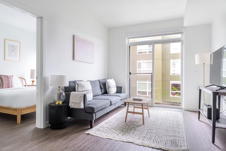 Salle de séjour élégante avec mobilier moderne dans un appartement à Spectra à Redmond, Redmond Salle de séjour élégante avec mobilier moderne dans un appartement à Spectra à Redmond, Redmond