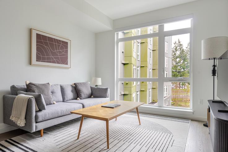 Salle de séjour élégante avec mobilier moderne dans un appartement à Spectra à Redmond, Redmond Salle de séjour élégante avec mobilier moderne dans un appartement à Spectra à Redmond, Redmond
