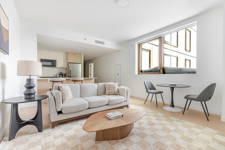 Elegantly designed living room with modern furnishings in an apartment at Four Williamsburg Wharf in Brooklyn, Brooklyn