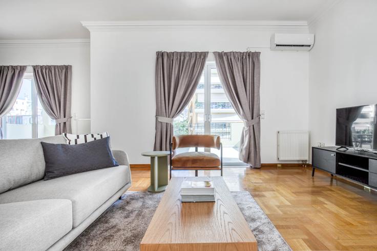 Chic living room with minimalist design from a furnished apartment in Glyfada, Athens