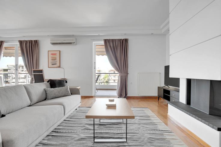 Elegantly designed living room with modern furnishings in an apartment at d2f265e0-5ede-4033-be3a-7a18f017dac0 in Glyfada, Athens