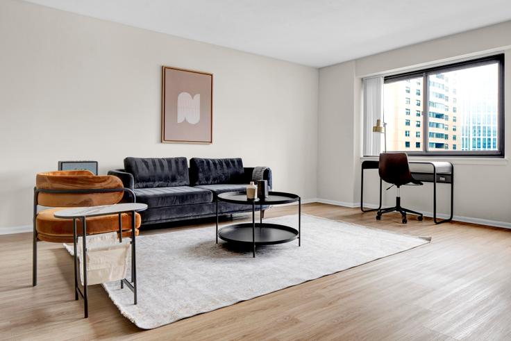 Elegantly designed living room with modern furnishings in an apartment at 10 Emerson in Beacon Hill, Boston