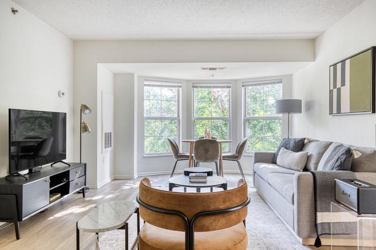 Elegantly designed living room with modern furnishings in an apartment at Avalon Cove in Jersey City, Jersey City Elegantly designed living room with modern furnishings in an apartment at Avalon Cove in Jersey City, Jersey City