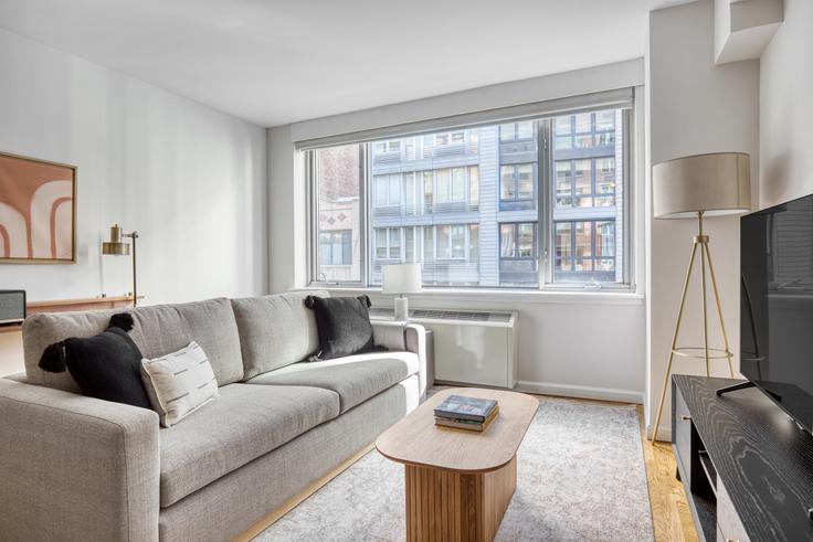 Elegantly designed living room with modern furnishings in an apartment at 21 Chelsea in Chelsea, New York