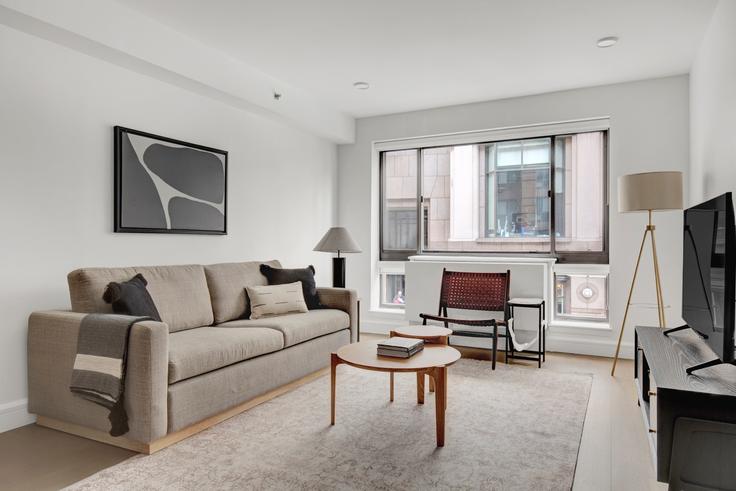 Elegantly designed living room with modern furnishings in an apartment at The Cameo in Midtown West, New York