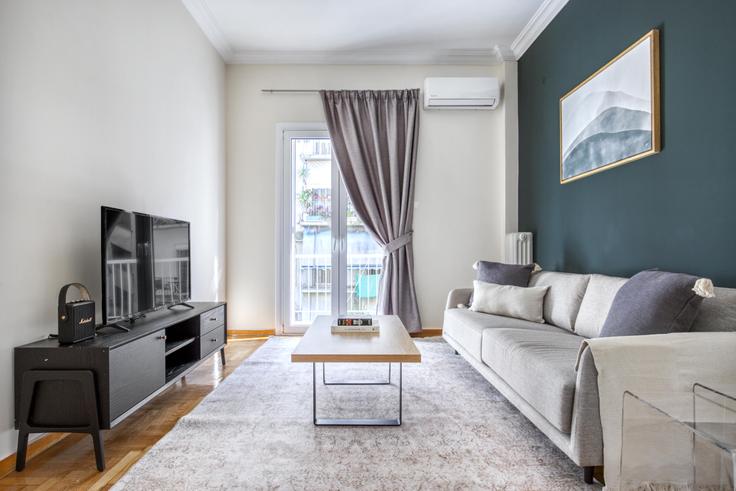 Elegantly designed living room with modern furnishings in an apartment at 0c54999c-3603-4942-9451-a83097f5aa72 in Pangrati, Athens