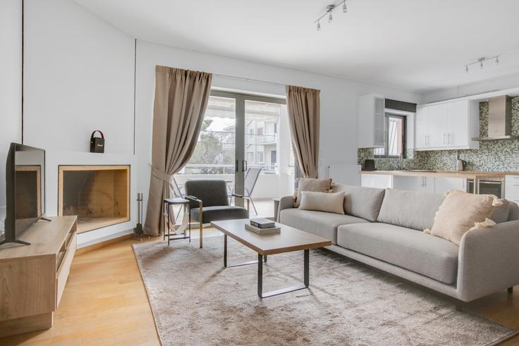 Elegantly designed living room with modern furnishings in an apartment at 2f4f9641-cc45-4154-a0e2-f96edad68668 in Agia Paraskevi, Athens