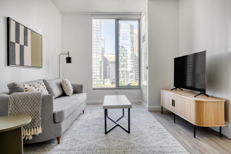 Elegantly designed living room with modern furnishings in an apartment at Spera in Rincon Hill, San Francisco Bay Area