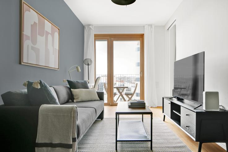 Elegantly designed living room with modern furnishings in an apartment at Metropolitan in Vienna, Vienna Elegantly designed living room with modern furnishings in an apartment at Metropolitan in Vienna, Vienna