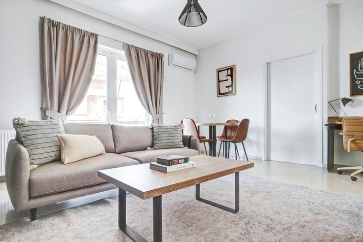 Chic living room with minimalist design from a furnished apartment in Voula, Athens