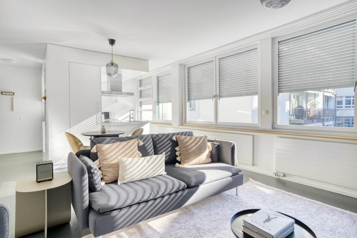 Elegantly designed living room with modern furnishings in an apartment at Rebgasse 8 in District 4, Langstrasse, Zurich