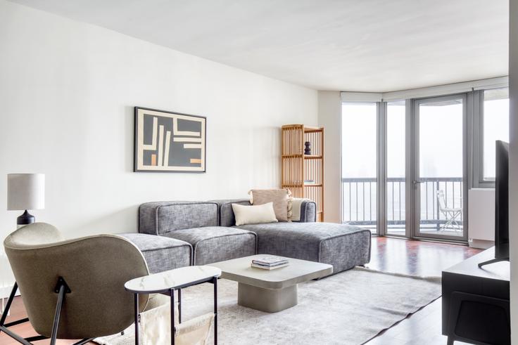 Elegantly designed living room with modern furnishings in an apartment at View 34 in Murray Hill, New York