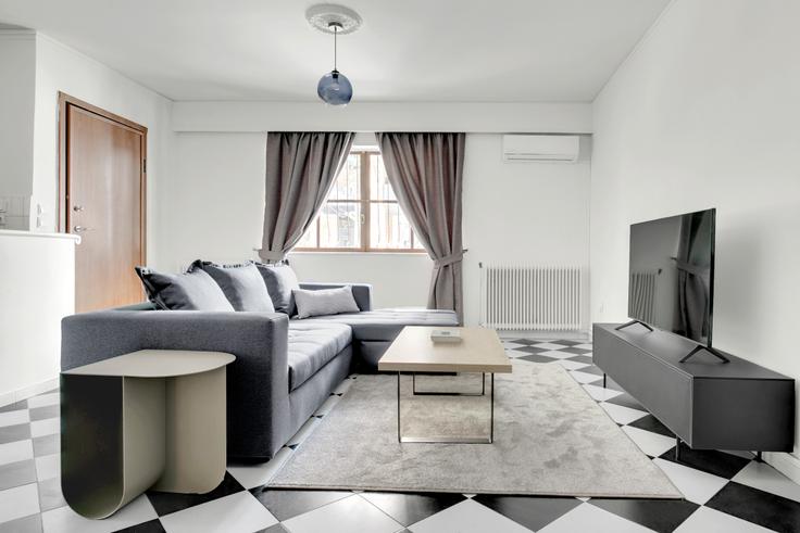 Elegantly designed living room with modern furnishings in an apartment at a91ddd37-d982-4cda-9bf5-72f3e98ec082 in Kifisia, Athens