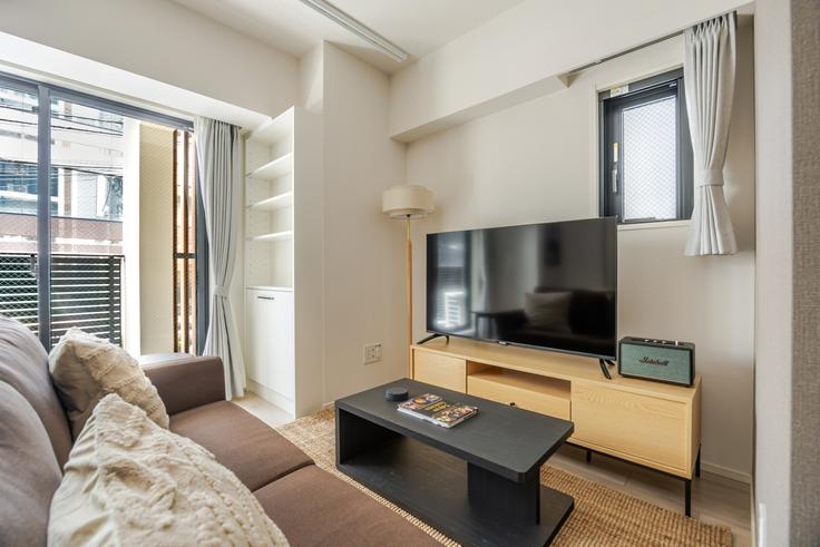 Elegantly designed living room with modern furnishings in an apartment at Live Casa Ochanomizu in Bunkyo City, Tokyo Elegantly designed living room with modern furnishings in an apartment at Live Casa Ochanomizu in Bunkyo City, Tokyo