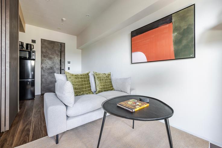 Elegantly designed living room with modern furnishings in an apartment at Duo Flats Ikejiri-Ohashi Norris in Meguro City, Tokyo Elegantly designed living room with modern furnishings in an apartment at Duo Flats Ikejiri-Ohashi Norris in Meguro City, Tokyo