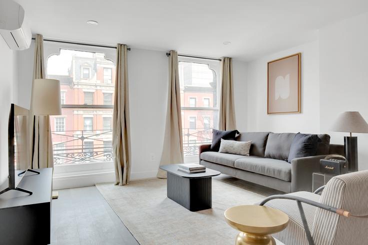 Elegantly designed living room with modern furnishings in an apartment at 180 Atlantic Avenue in Cobble Hill, New York