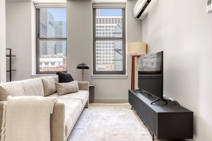 Elegantly designed living room with modern furnishings in an apartment at 330 S Wells in The Loop, Chicago