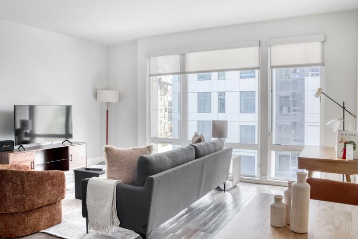 Elegantly designed living room with modern furnishings in an apartment at Mark on 8th in South Lake Union, Seattle