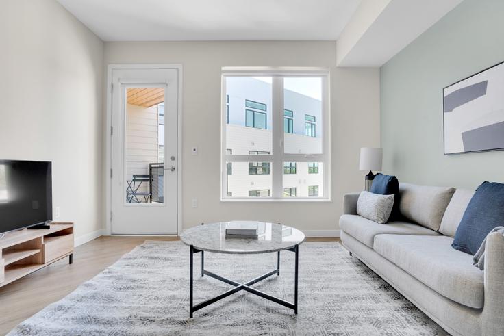 Elegantly designed living room with modern furnishings in an apartment at Maxwell Apartments in Sunnyvale, San Francisco Bay Area