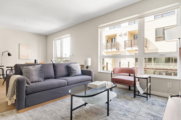 Elegantly designed living room with modern furnishings in an apartment at Maxwell Apartments in Sunnyvale, San Francisco Bay Area