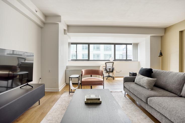 Elegantly designed living room with modern furnishings in an apartment at 1 Emerson Place in Beacon Hill, Boston