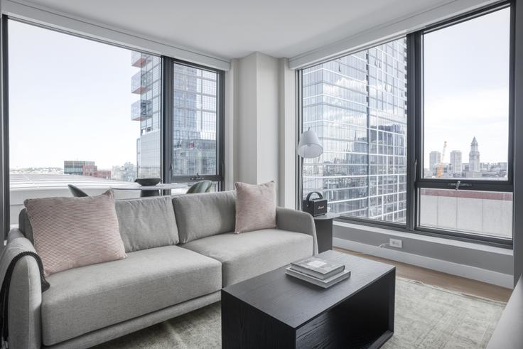 Elegantly designed living room with modern furnishings in an apartment at Avalon North Station in North Station, Boston