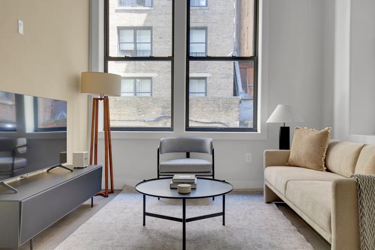 Elegantly designed living room with modern furnishings in an apartment at 241 West 75th Street in Upper West Side, New York