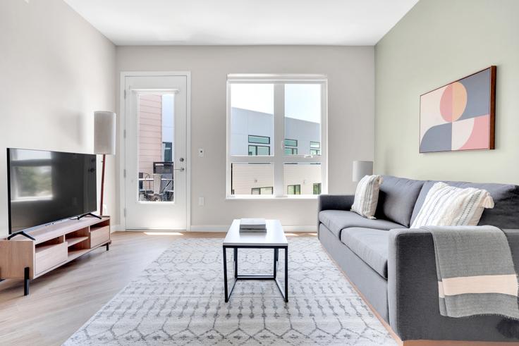 Elegantly designed living room with modern furnishings in an apartment at Maxwell Apartments in Sunnyvale, San Francisco Bay Area