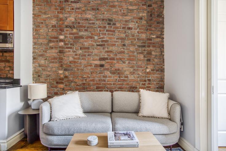 Elegantly designed living room with modern furnishings in an apartment at 234 West 14th in West Village, New York