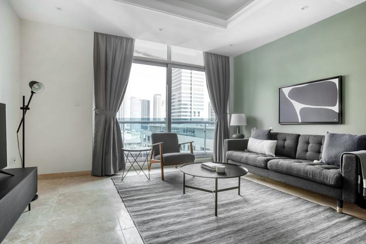 Chic living room with minimalist design from a furnished apartment in Orra Marina, Dubai