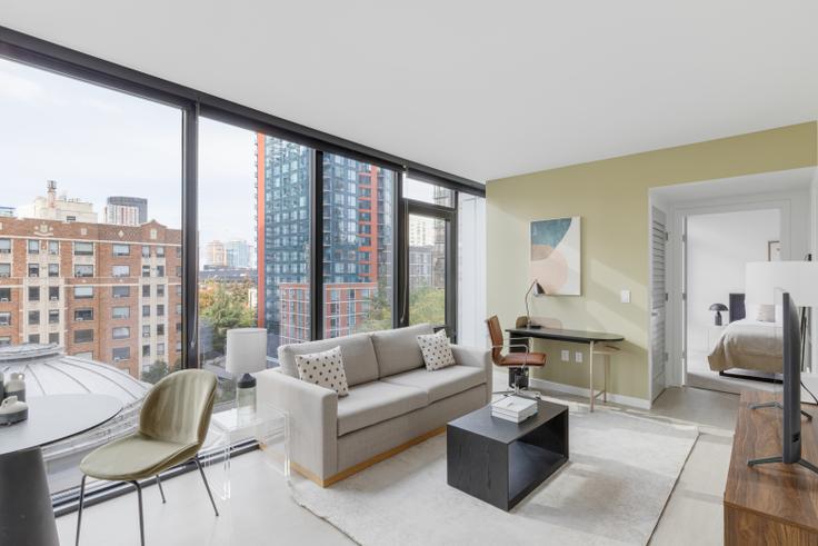 Elegantly designed living room with modern furnishings in an apartment at Ovation - East Building in First Hill, Seattle