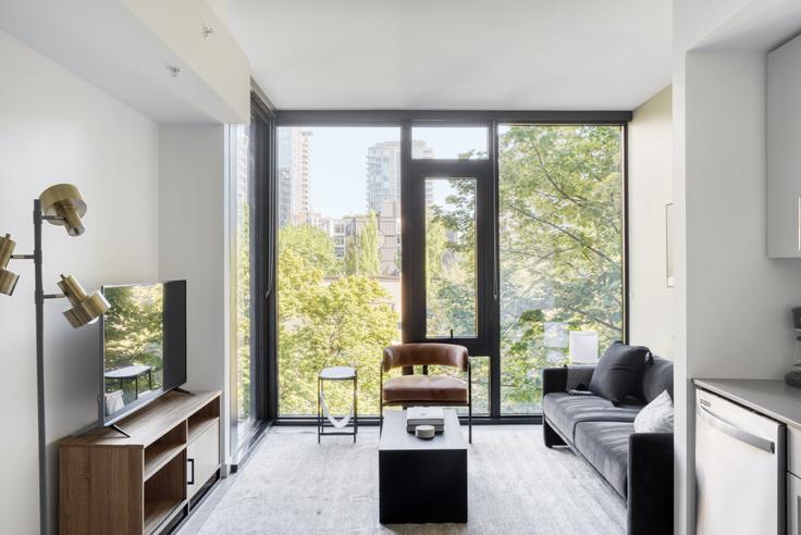 Elegantly designed living room with modern furnishings in an apartment at Ovation - East Building in First Hill, Seattle