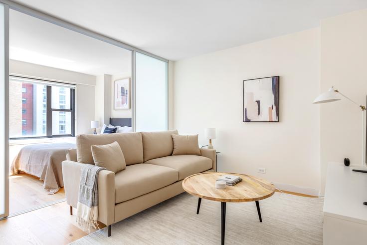 Elegantly designed living room with modern furnishings in an apartment at Olympia House in Murray Hill, New York