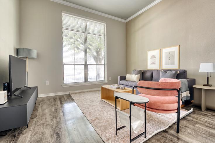 Elegantly designed living room with modern furnishings in an apartment at 404 Rio Grande in Downtown, Austin