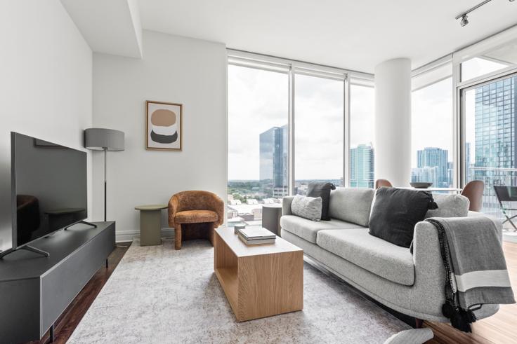 Elegantly designed living room with modern furnishings in an apartment at Whitley in Downtown, Austin