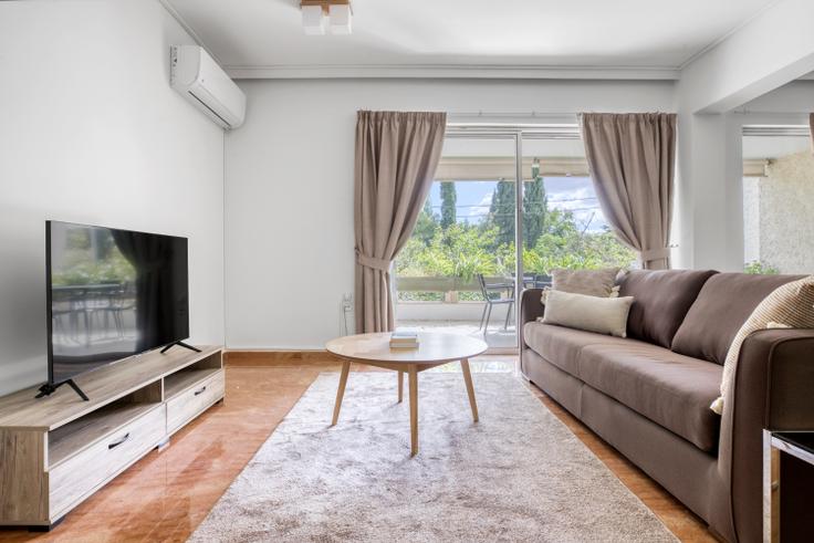 Chic living room with minimalist design from a furnished apartment in Kifisia, Athens