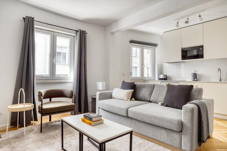 Elegantly designed living room with modern furnishings in an apartment at Maestro 1 in Lapa, Lisbon