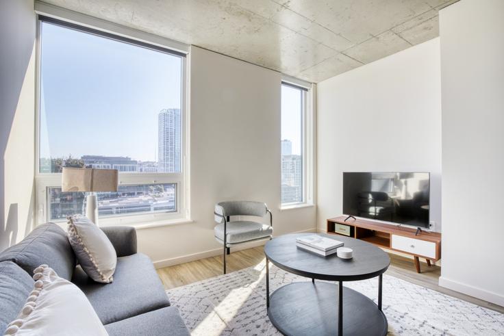 Elegantly designed living room with modern furnishings in an apartment at The Waverly in South Lake Union, Seattle