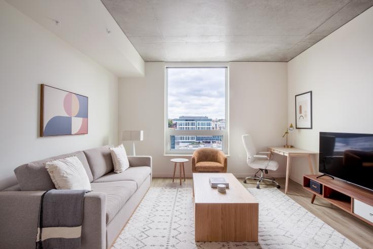 Elegantly designed living room with modern furnishings in an apartment at The Waverly in South Lake Union, Seattle