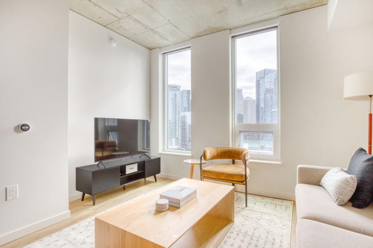 Elegantly designed living room with modern furnishings in an apartment at The Waverly in South Lake Union, Seattle